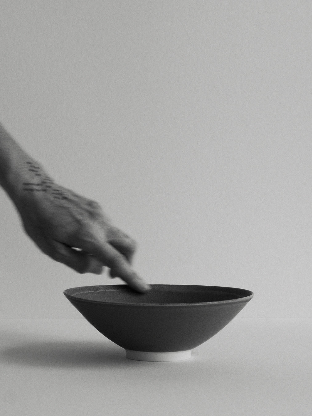 Conical stoneware bowl in blue-grey tones