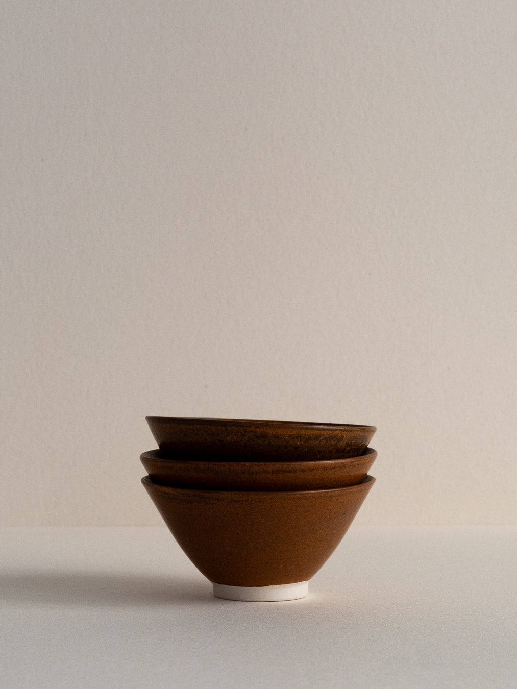 Conical glass in oxidized brown tones