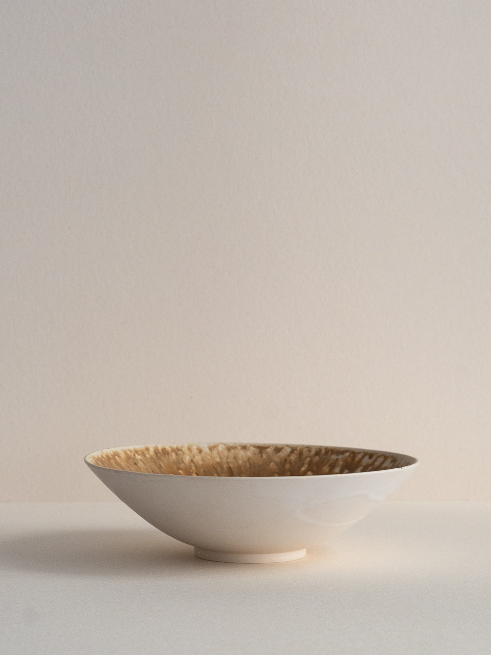 Conic bowl with ash glaze effects