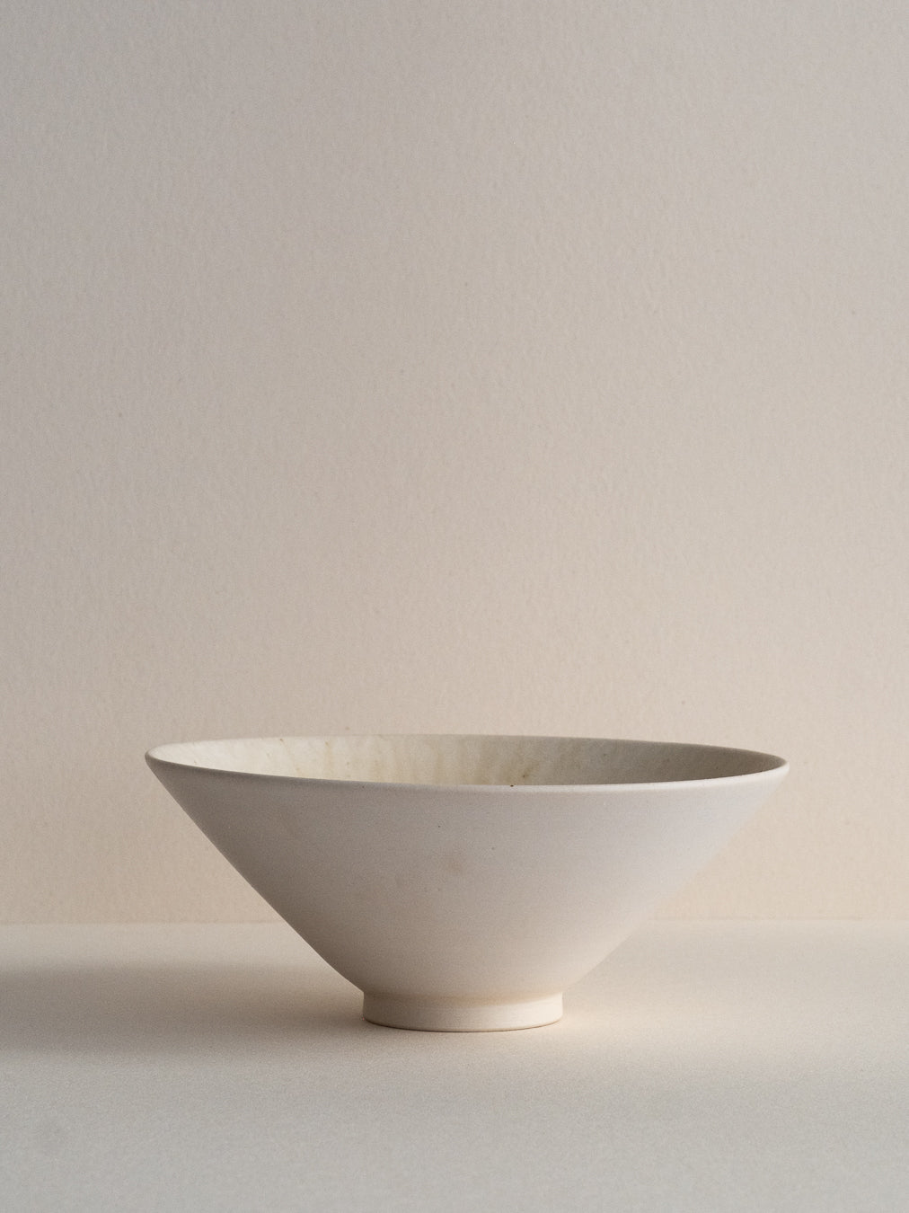 Conic bowl with ash glaze effects