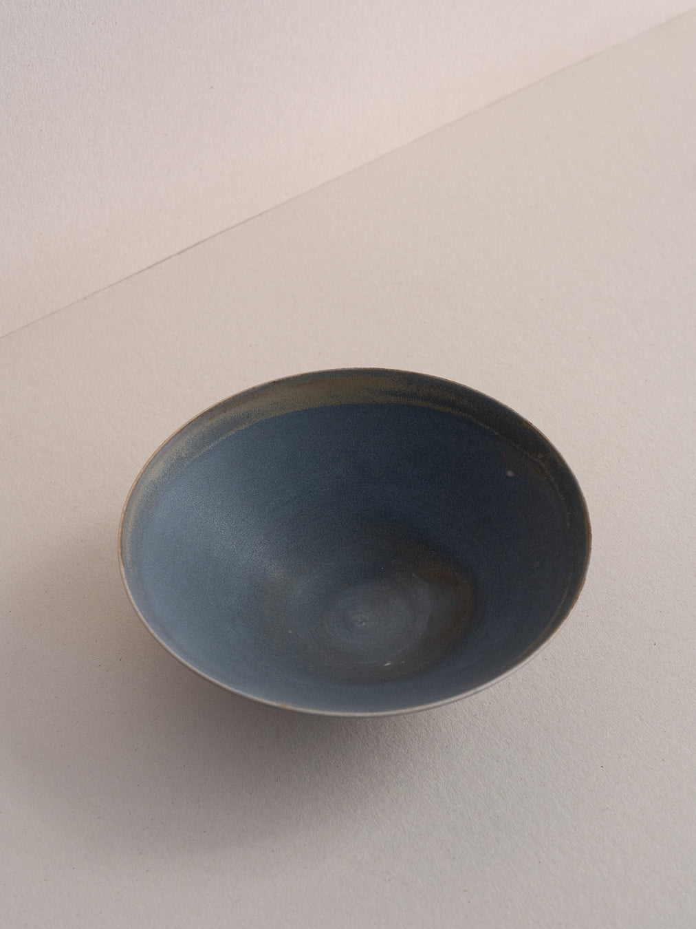 Conical stoneware bowl in blue-grey tones