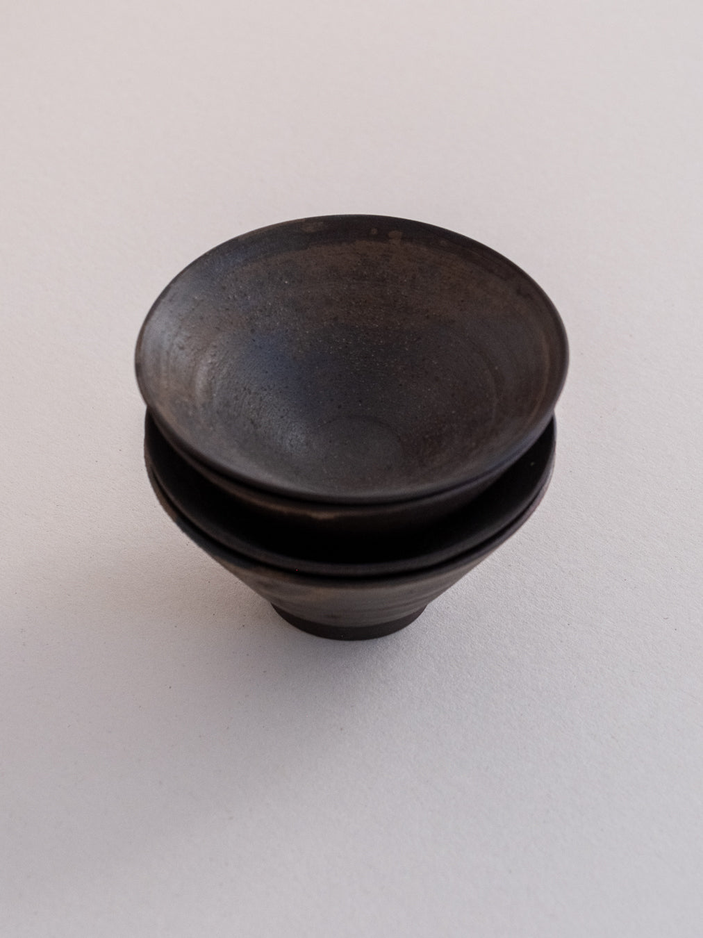 Conic glass finished with a pine ash glaze that creates natural